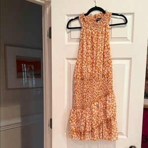 IN THE BEGINNING.  Tiered Smocked Halter Mini Dress in Orange Floral